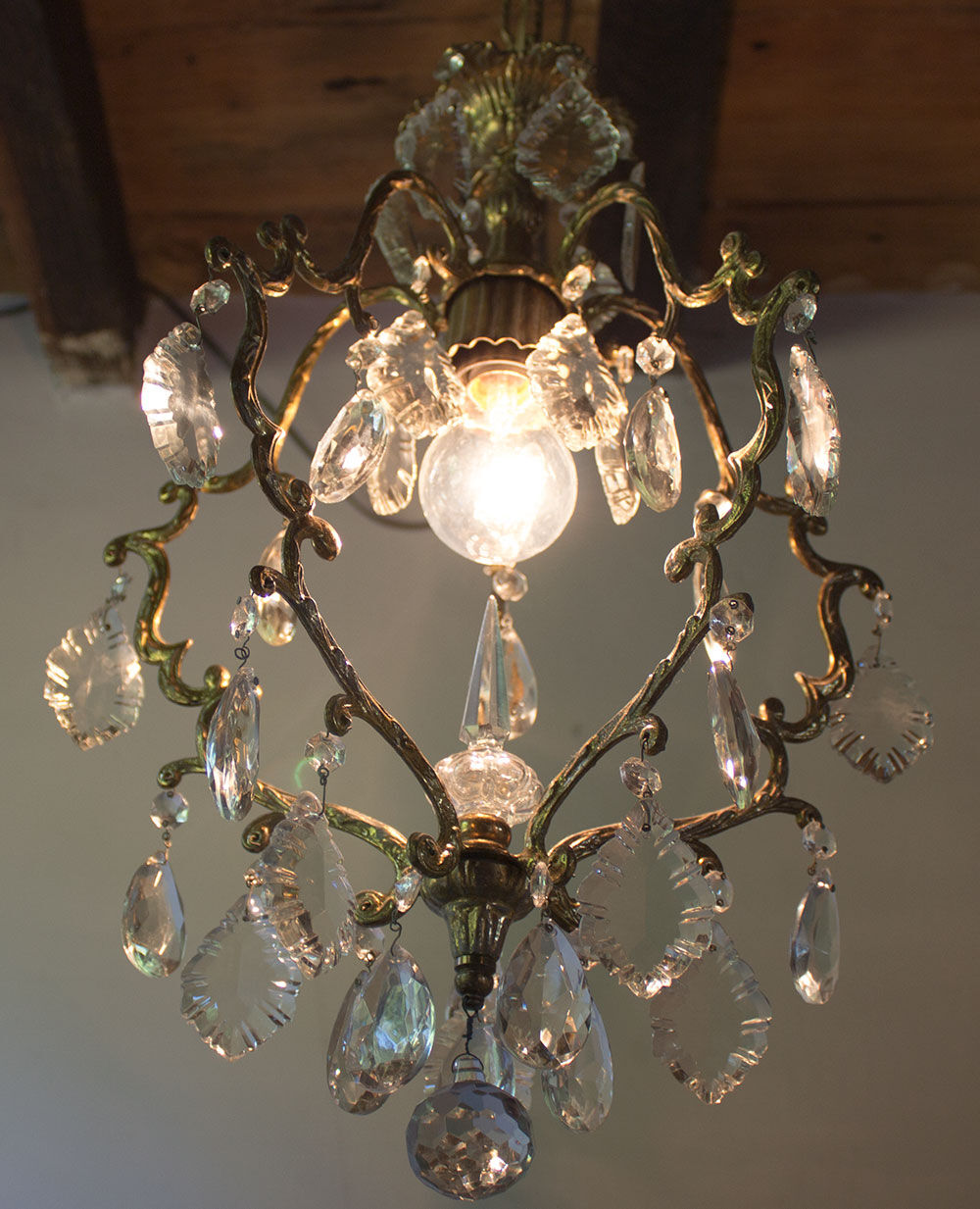 Old brass chandelier with glass stamps
