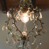 Old brass chandelier with glass stamps