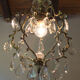 Old brass chandelier with glass stamps