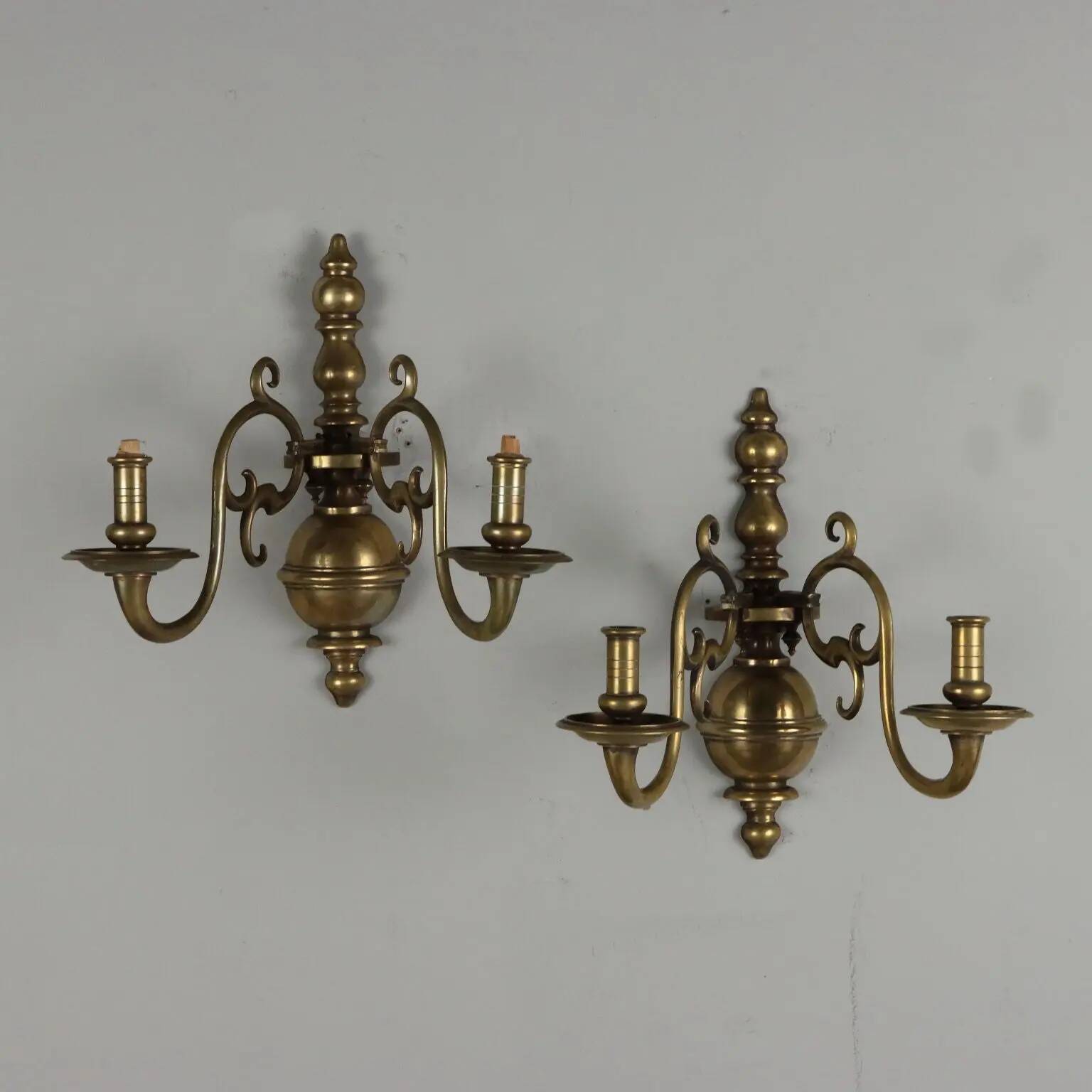 Pair of antique wall sconces in 20th-century Baroque style.