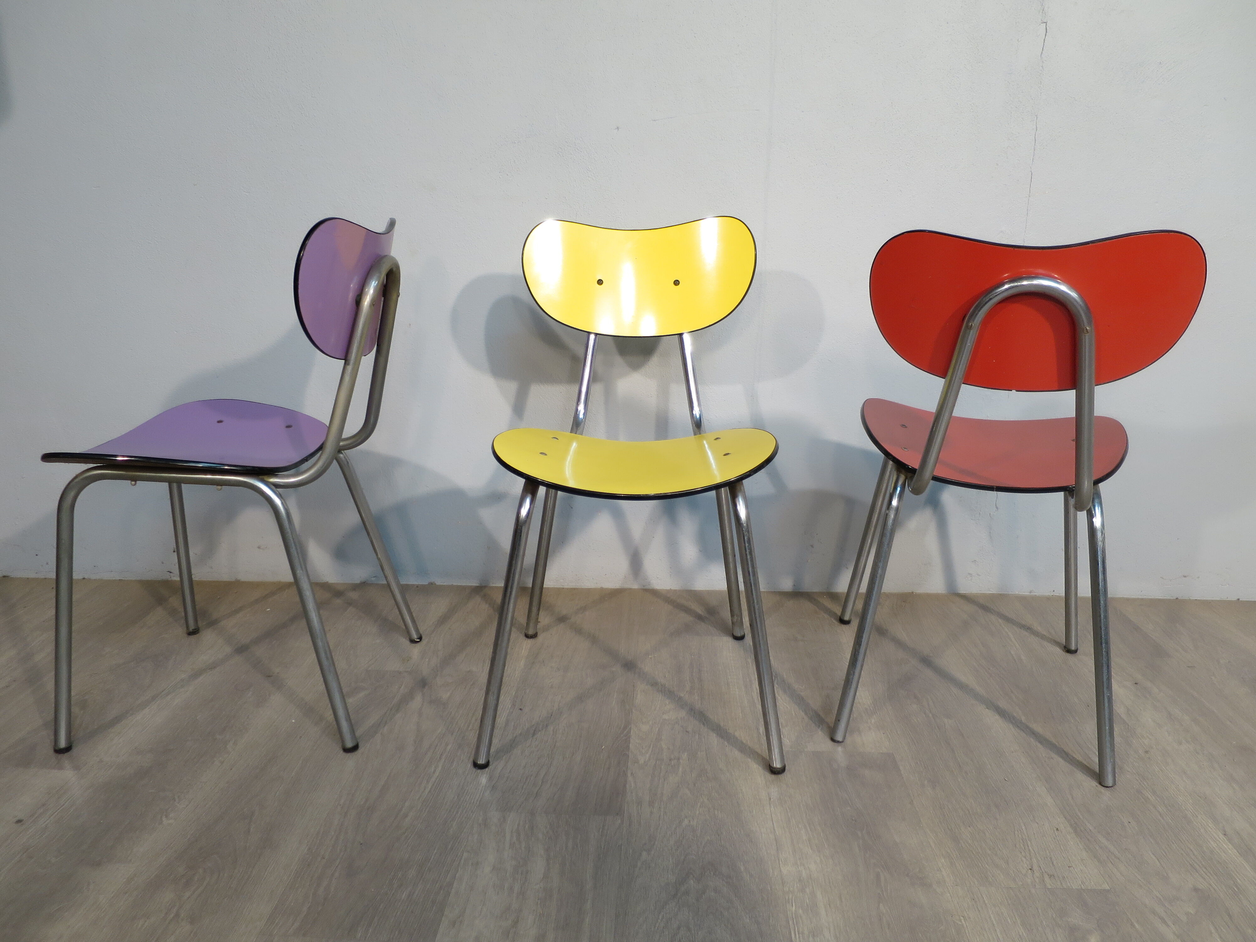 3 colored formica chairs