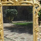 Miroir Louis XV bois doré à parecloses