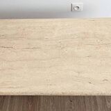 Beige travertine coffee table in the style of Italian design, 120 x 60 cm.