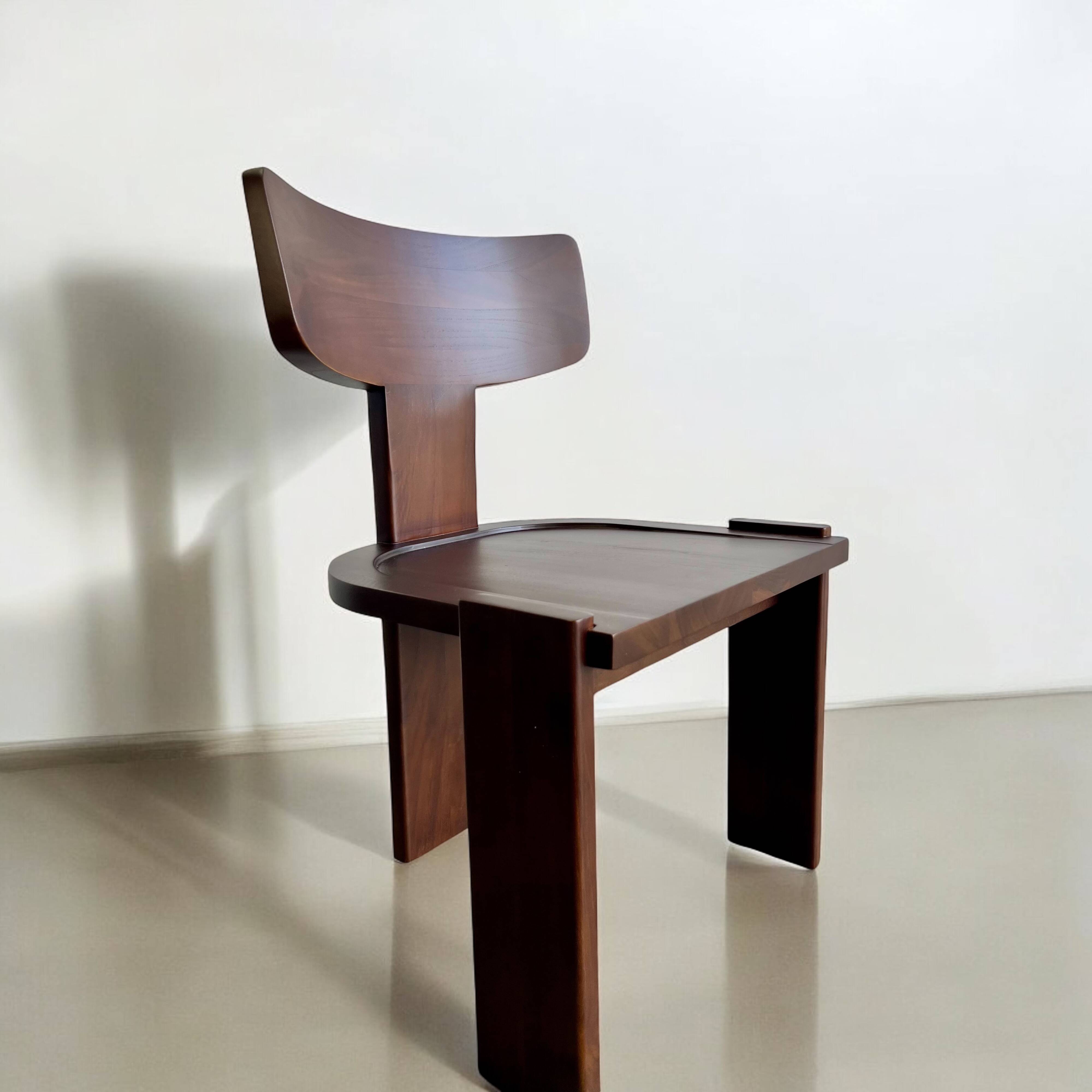 Retro brutalist chair in dark solid wood