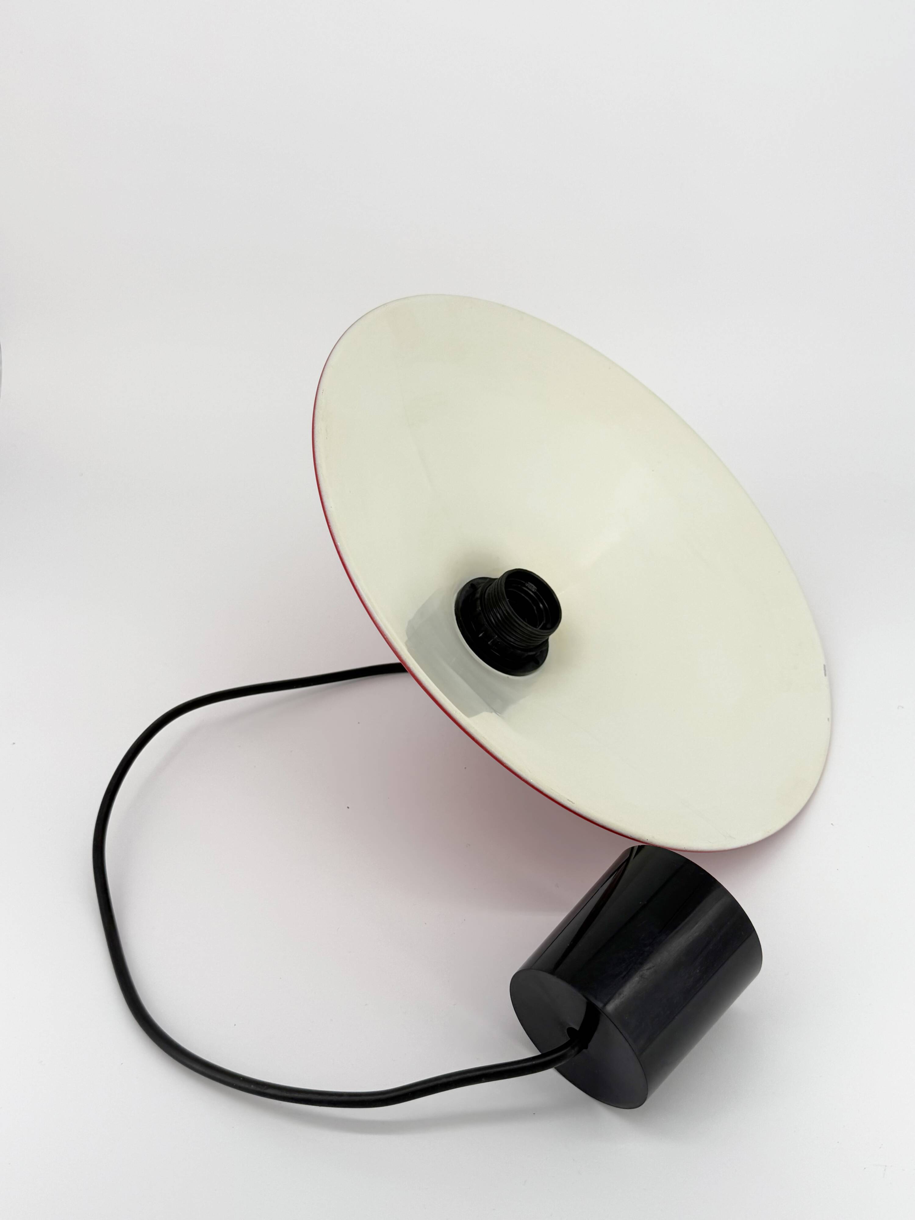 Red conical pendant light in enamelled metal