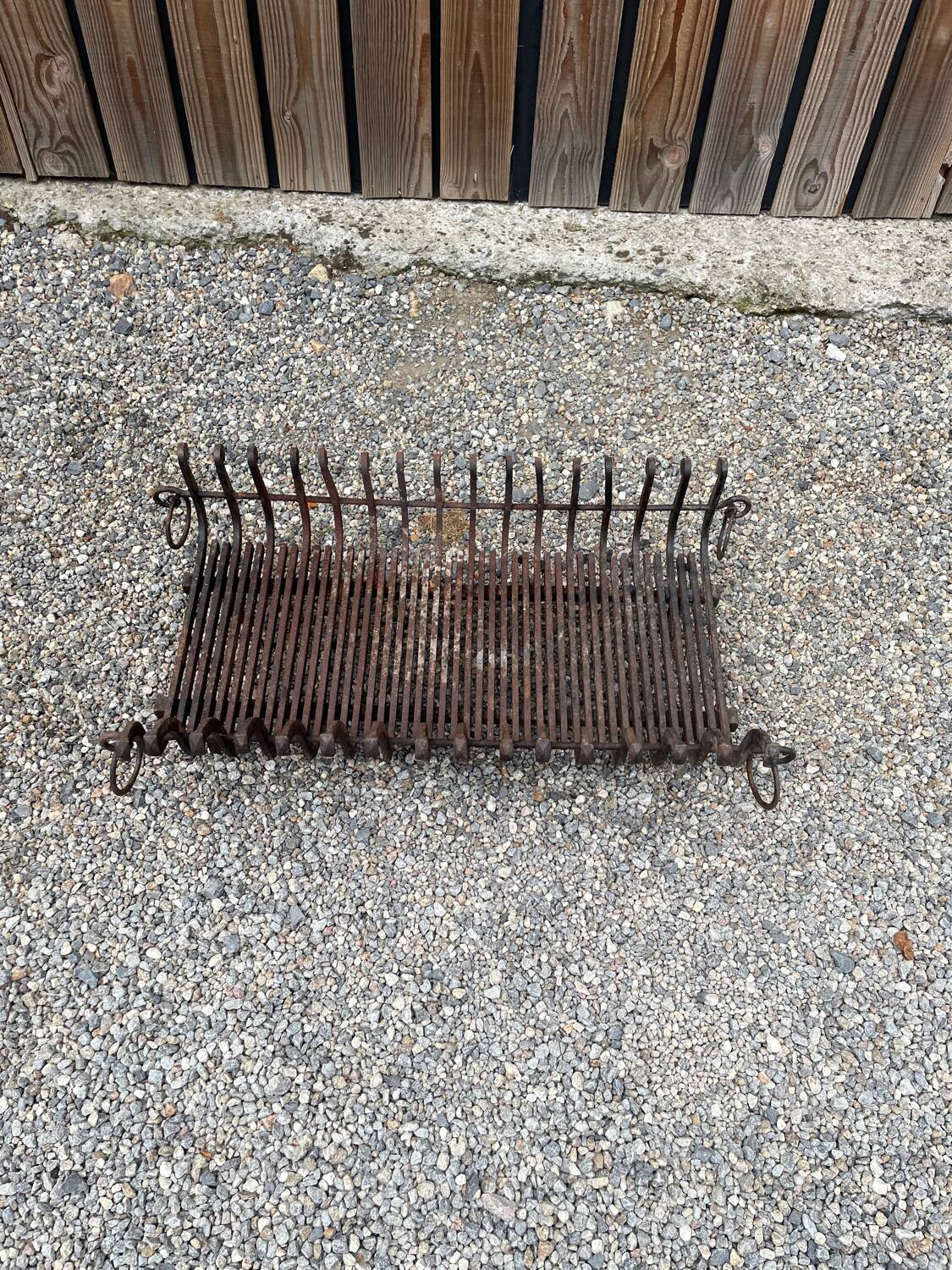 Vintage cast iron fireplace cradle with 16 bars.