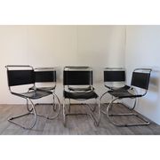Series of 6 minimalist chairs in chrome metal and black leather around 1970