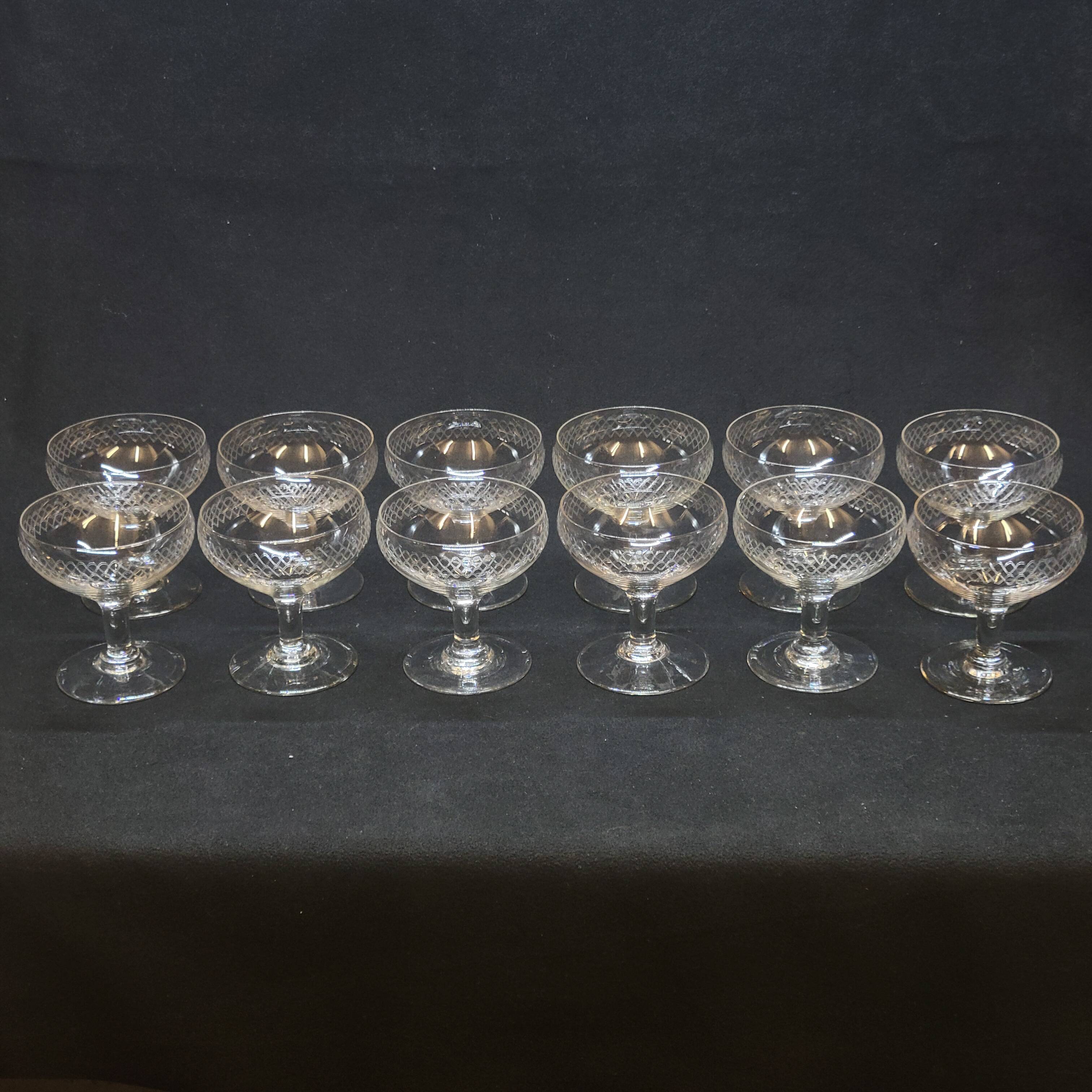 12 old champagne glasses in blown and engraved glass