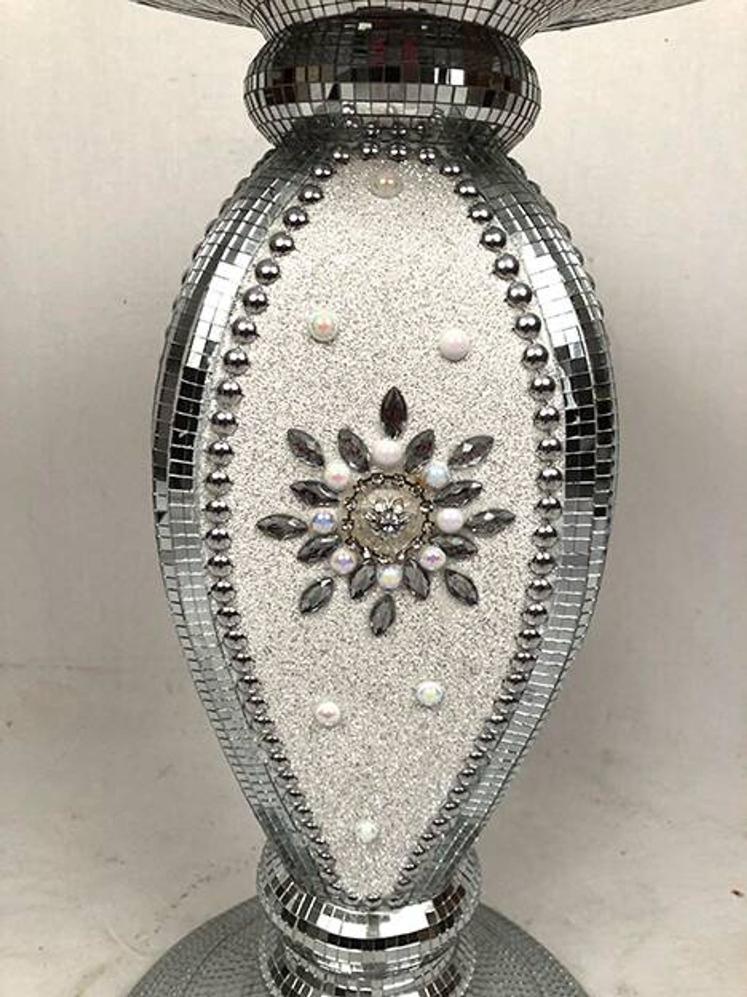 Small wooden pedestal table entirely covered with mirror mosaic