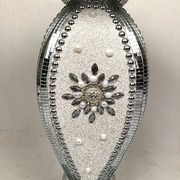 Small wooden pedestal table entirely covered with mirror mosaic