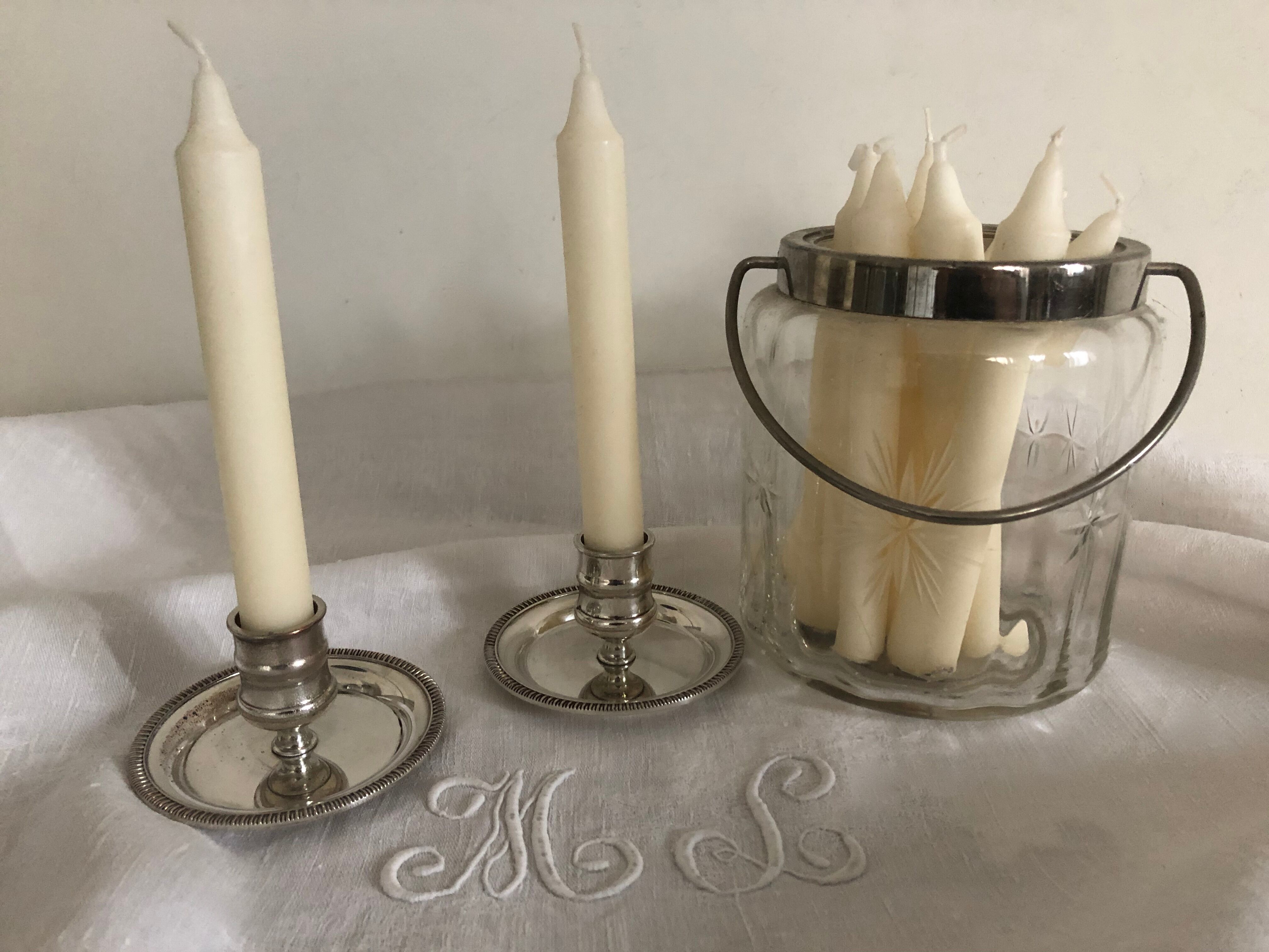 Two silver metal candlesticks