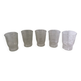 Old digestif or liqueur glasses, handcrafted glass with a floral pattern.