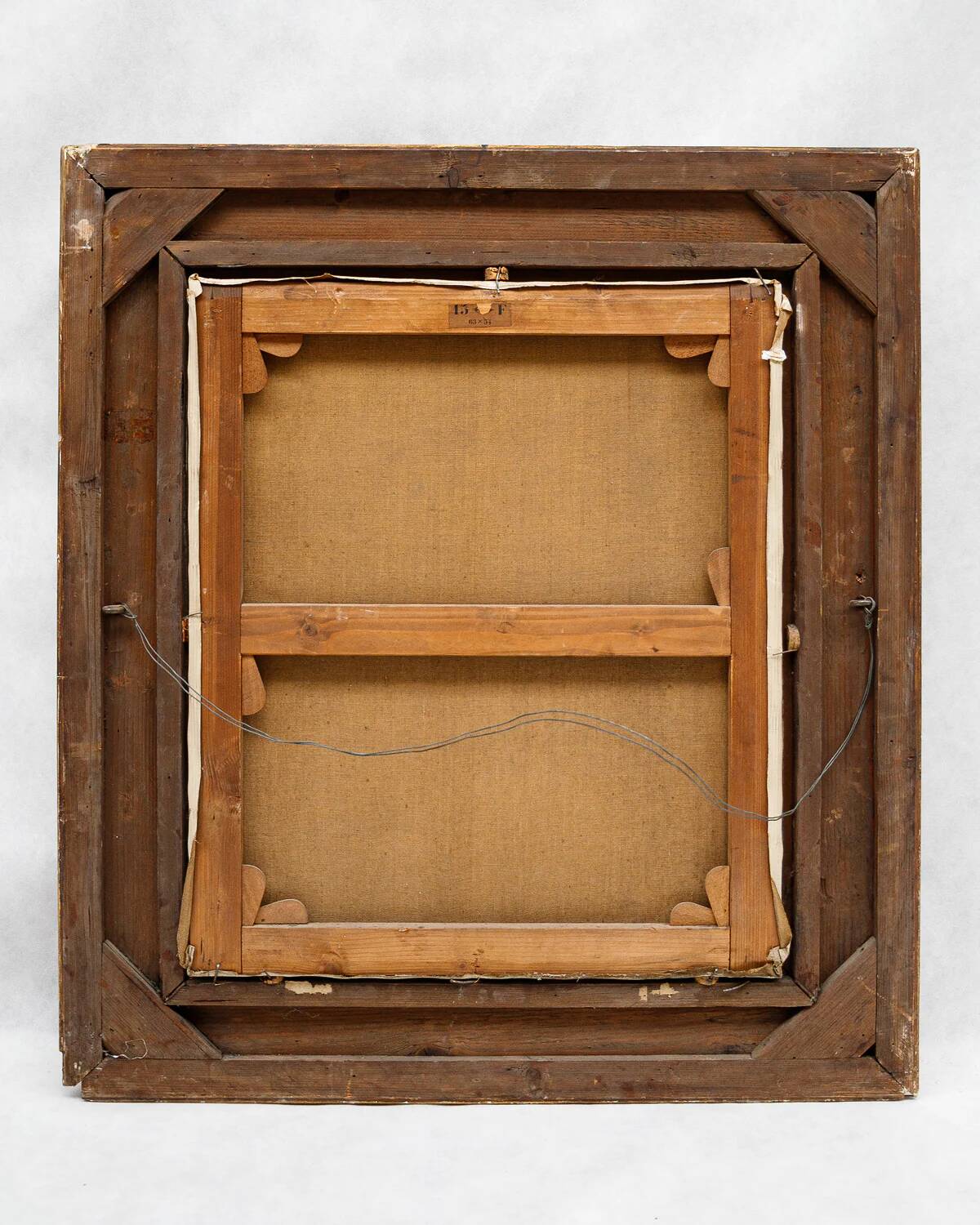 Antique portrait painting of a decorated gentleman with icy blue eyes