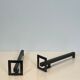 Pair of modernist andirons in steel and wrought iron