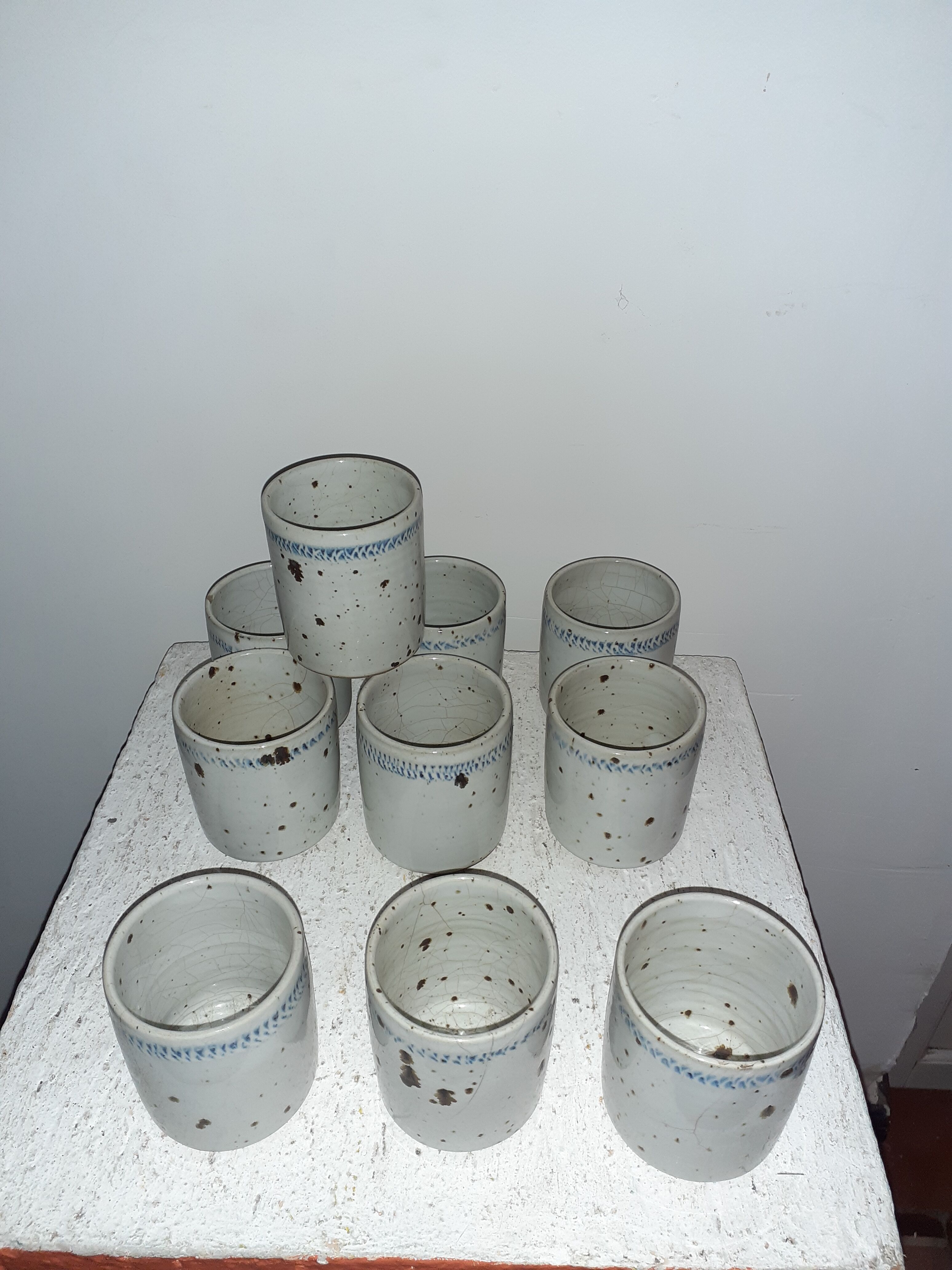 10 cups in enamelled pyrity stoneware
