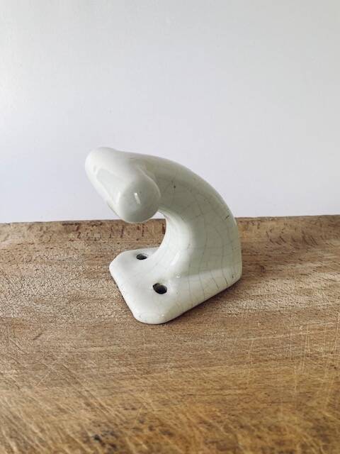 Enamelled earthen coat hook, 1900