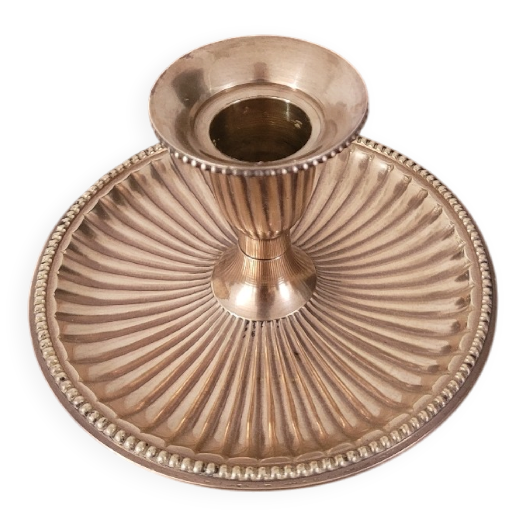 Brass candlestick with a ribbed dish