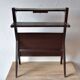 Old Scandinavian style magazine rack in dark wood with integrated brass ashtray
