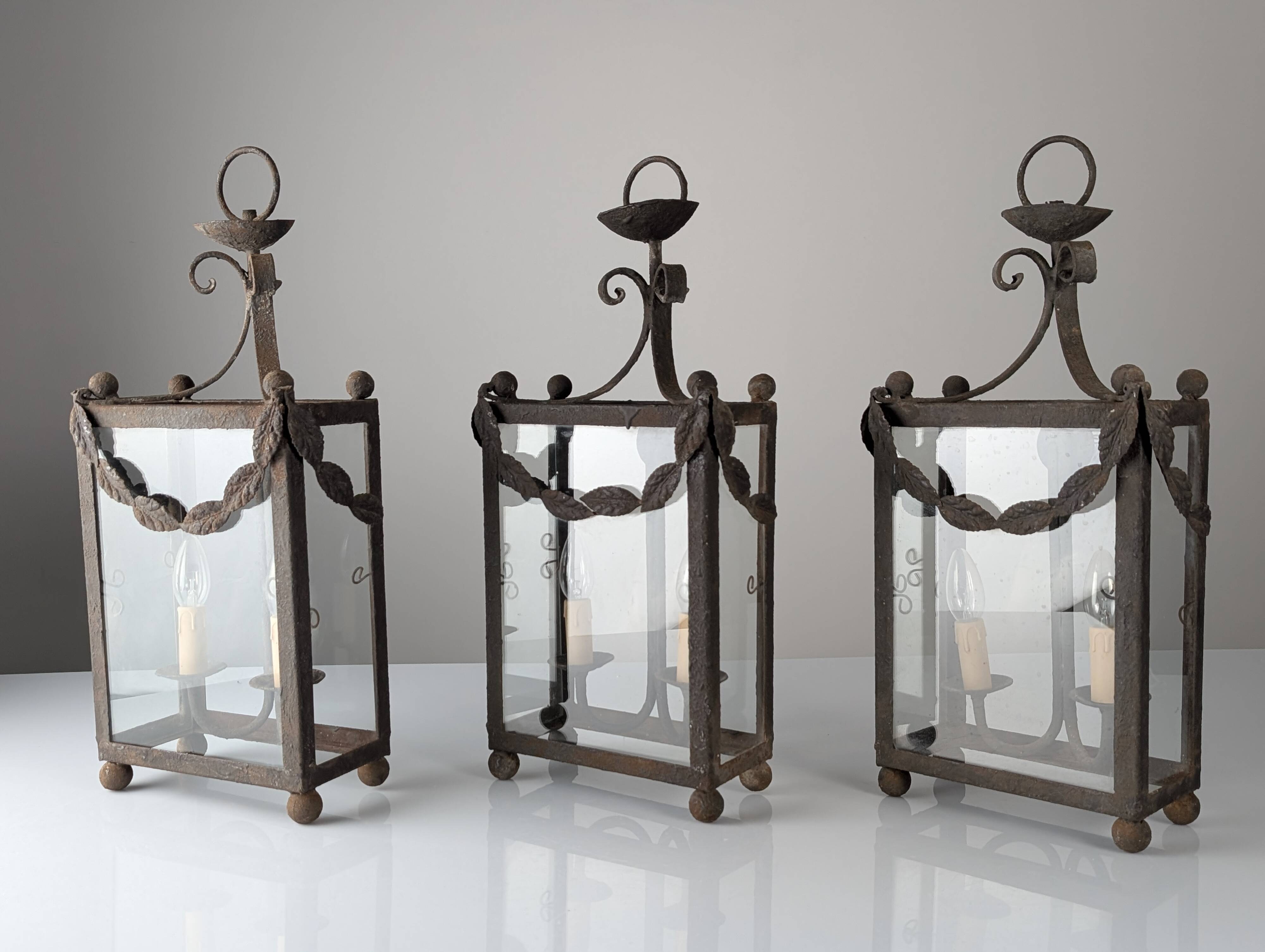 Wrought iron lantern with glass panels, leaf motifs