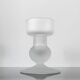 Sculptural candle holder in frosted glass.