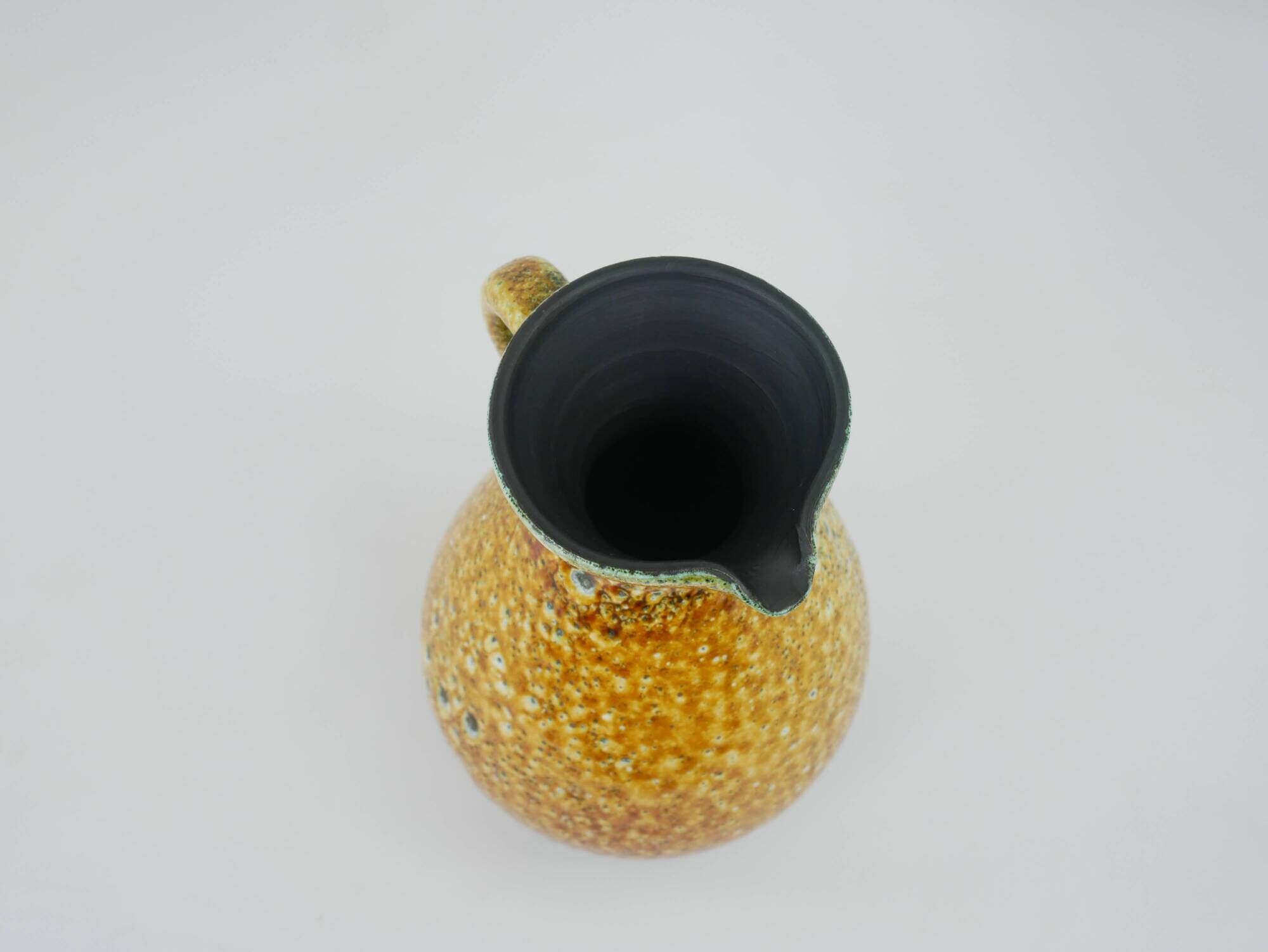 Large yellow ceramic pitcher in the Accolay style
