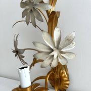 Vintage Hollywood Regency gold metal leaf wall sconce.