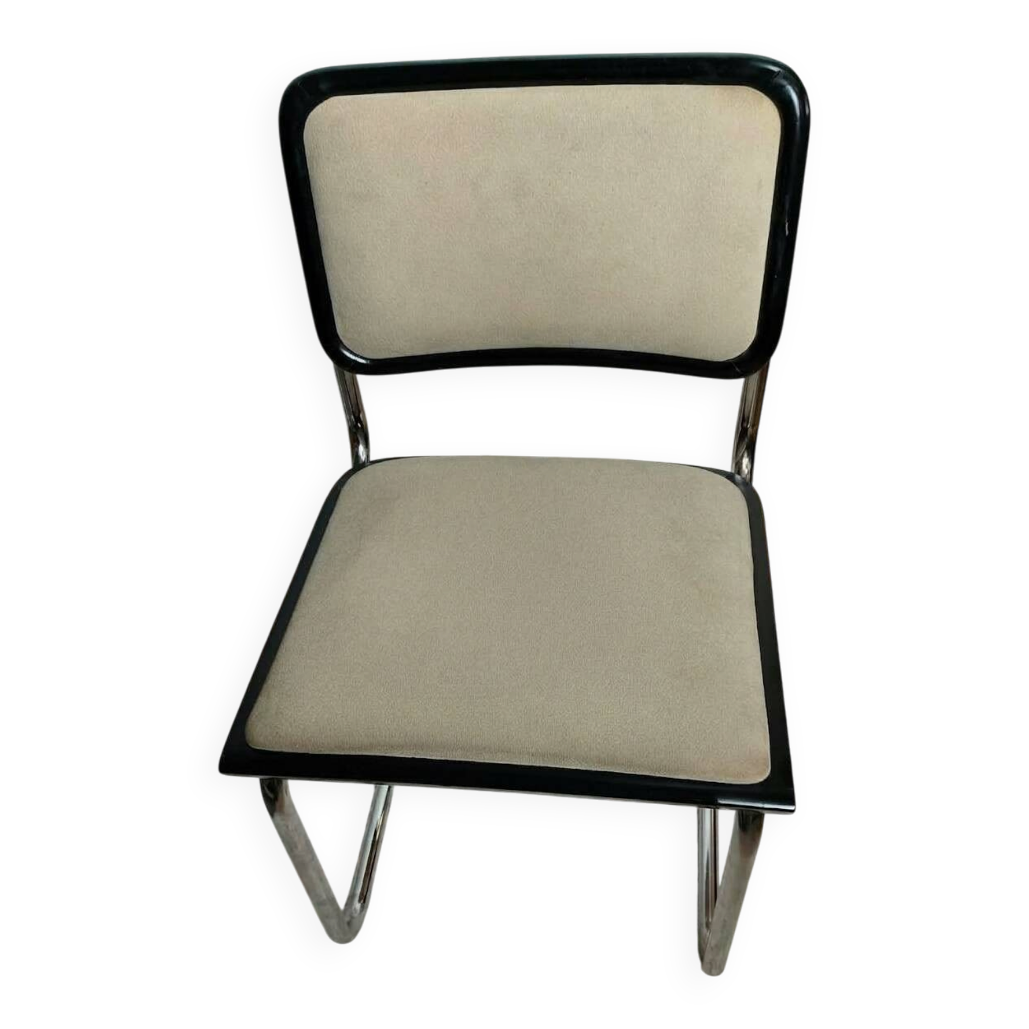 Cesca B32 chair by Marcel Breuer, upholstered in beige fabric.