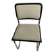 Cesca B32 chair by Marcel Breuer, upholstered in beige fabric.