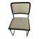Cesca B32 chair by Marcel Breuer, upholstered in beige fabric.