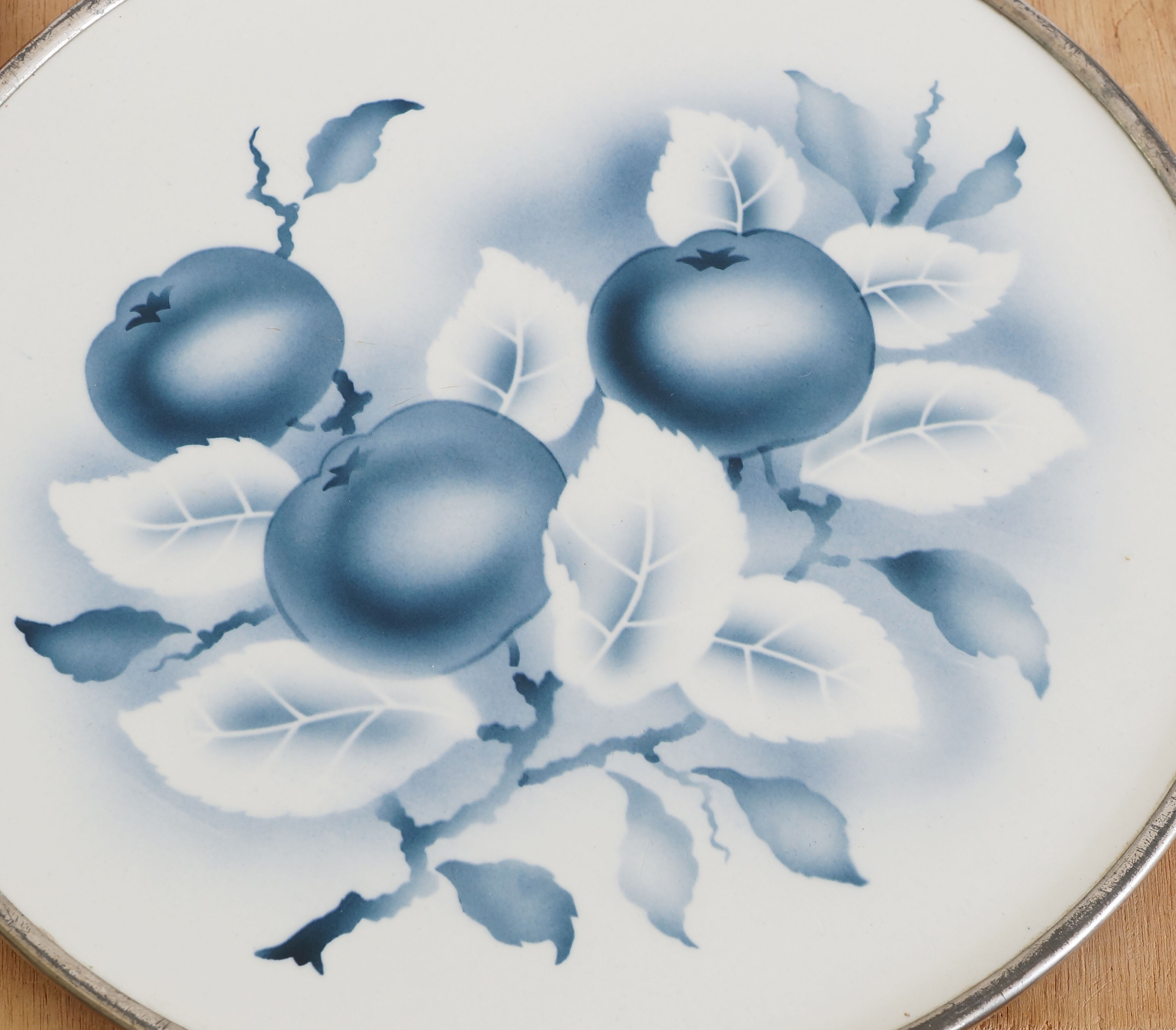 Round earthenware and metal trivets in the 30s or 40s