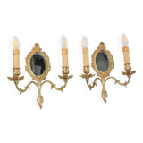 Pair of Louis XV style beveled mirror sconces in bronze by Lucien Gau