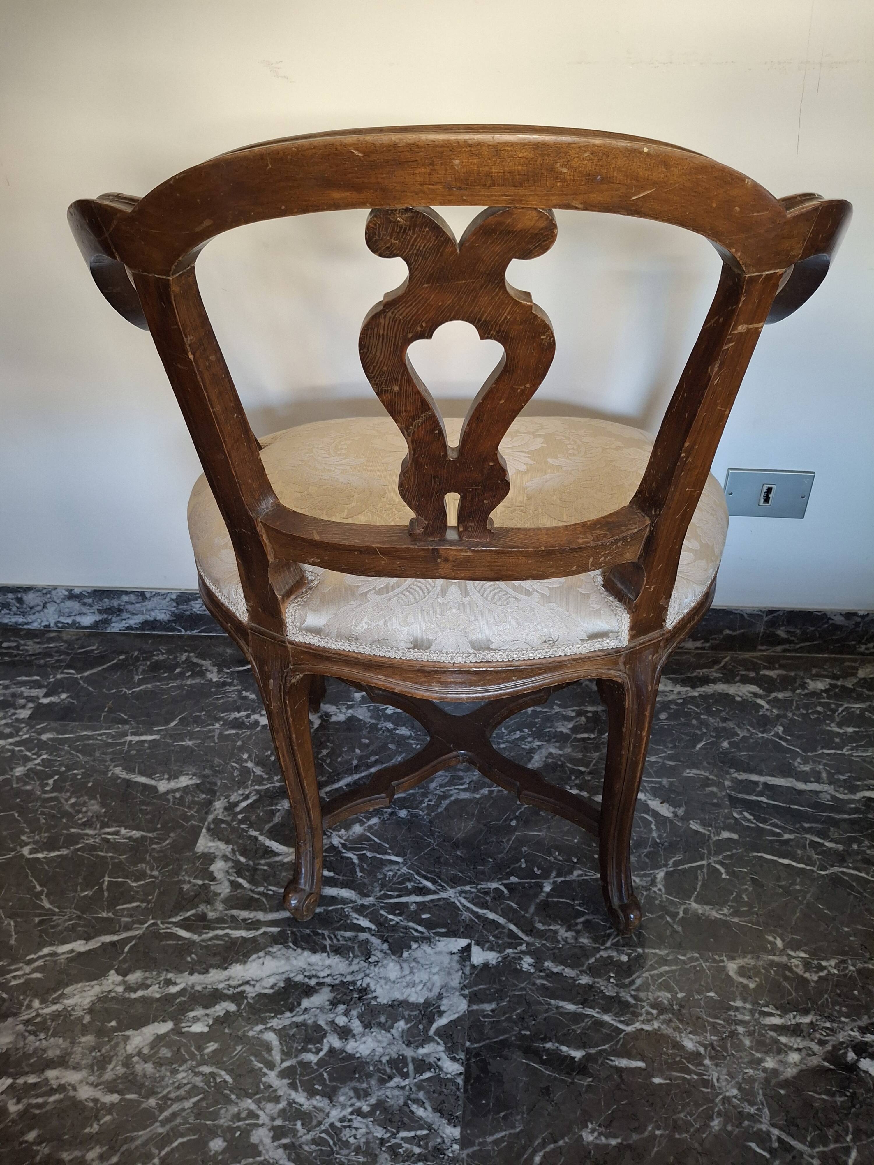 Pair of Italian armchairs from the 1960s with matching ottoman.