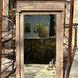 Imposing fireplace mirror in carved and painted wood, 19th century.