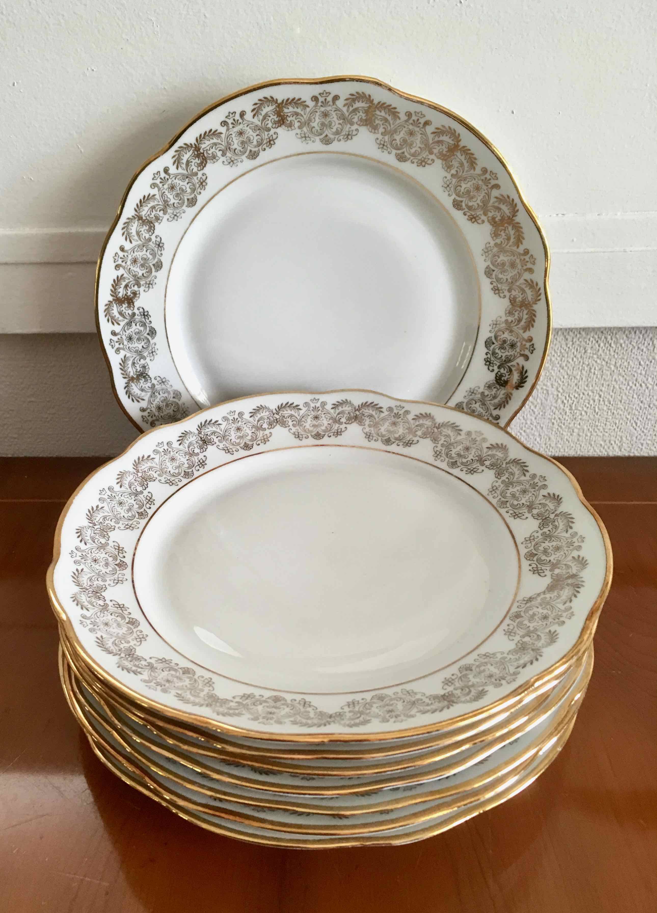 8 white and gold porcelain dessert plates