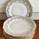8 white and gold porcelain dessert plates