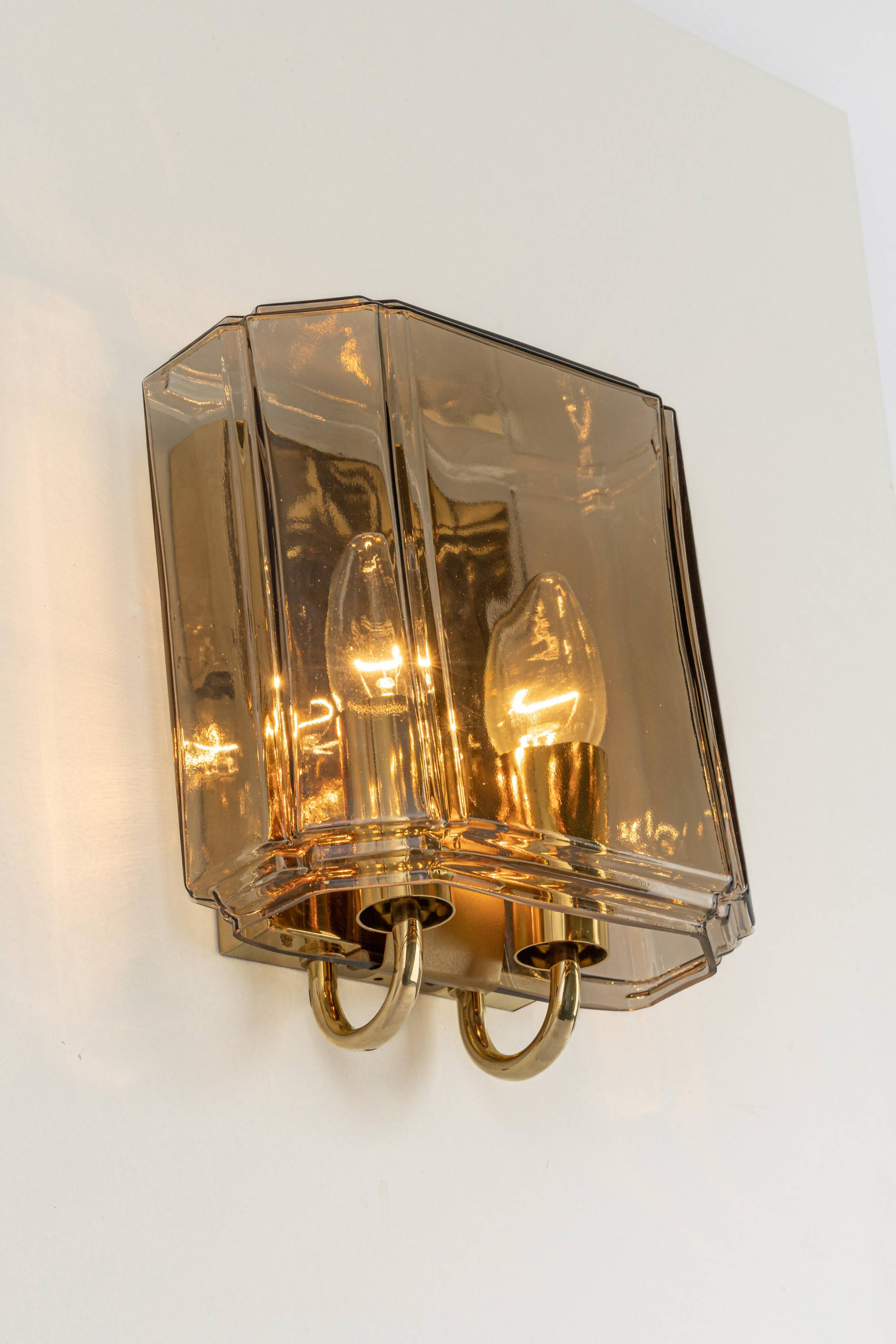 Large smoked glass wall sconces by Limburg, Germany.