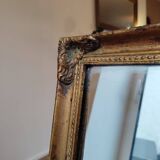 Miroir en bois, doré à la feuille d'or.