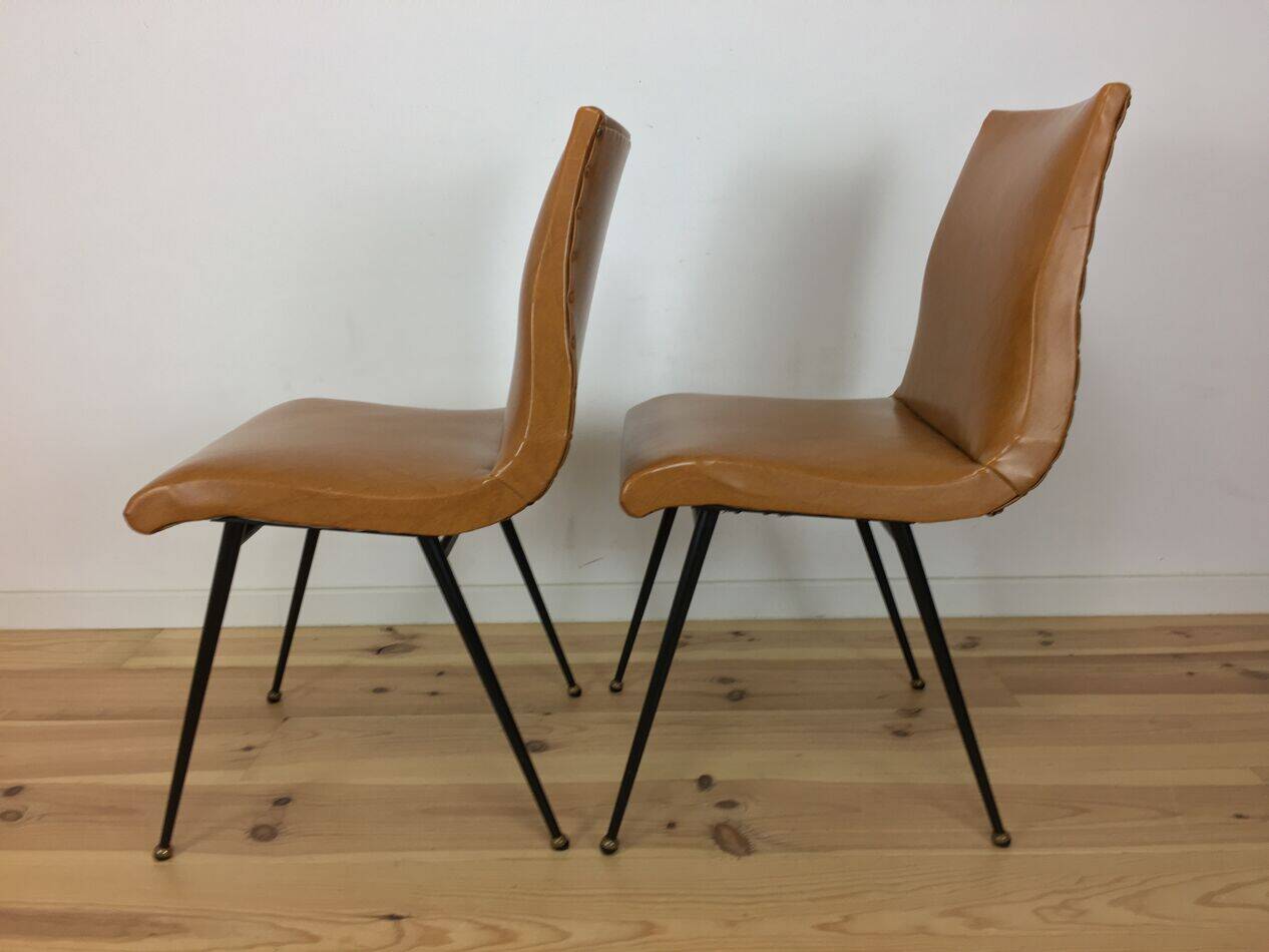 Pair of 1950s chairs with compass legs and brown faux leather.