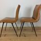 Pair of 1950s chairs with compass legs and brown faux leather.