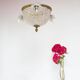 Old bronze ceiling light and 3 tulip flowers