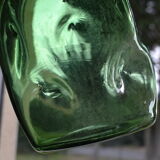 Dented green bottle