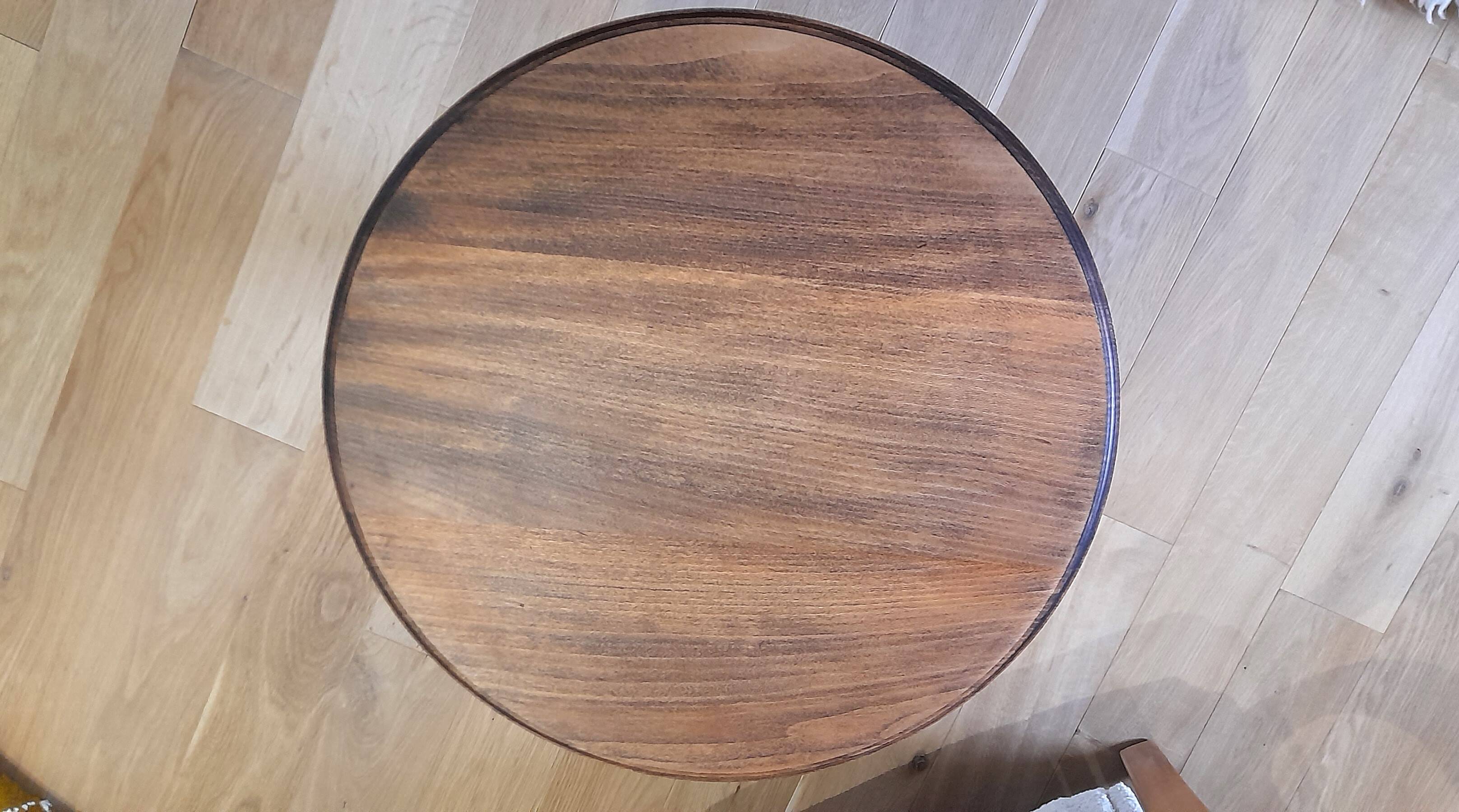 Brutalist side table with turned wood and wine press leg.