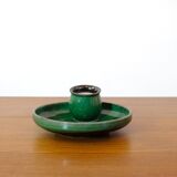 Glazed green earthenware candlestick