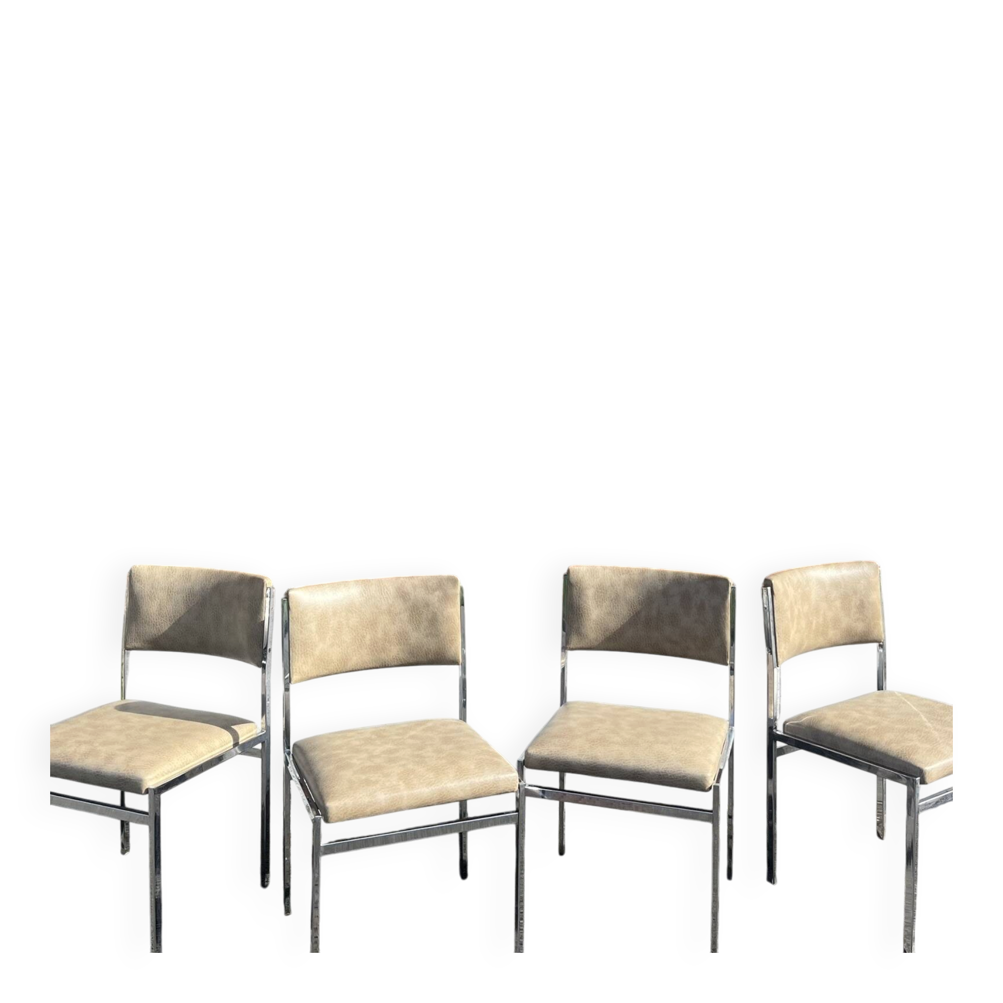 Set of 4 vintage chairs in chrome and faux leather.