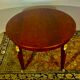 Empire style round table in mahogany