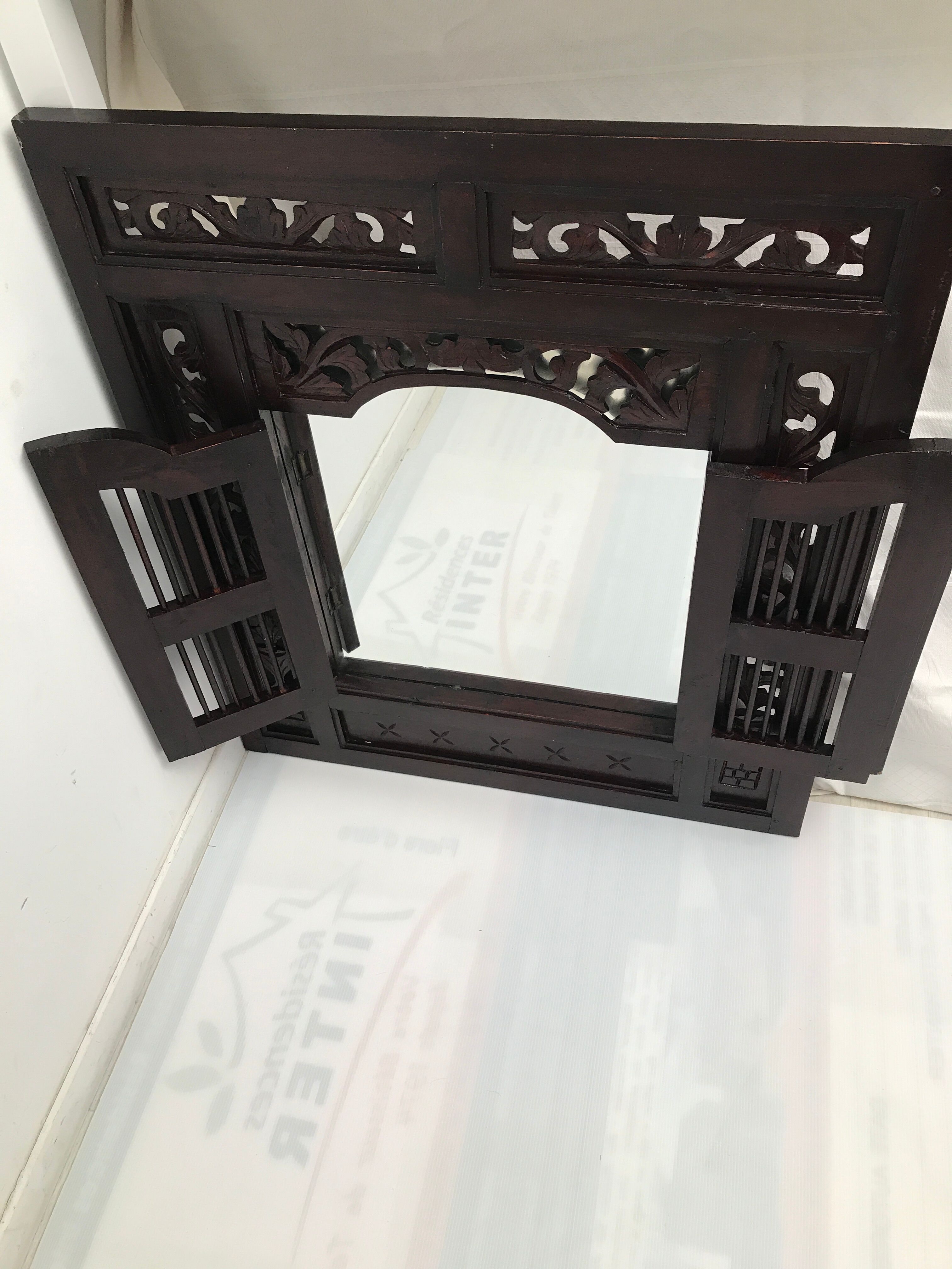 Vintage shuttered Indonesian mirror