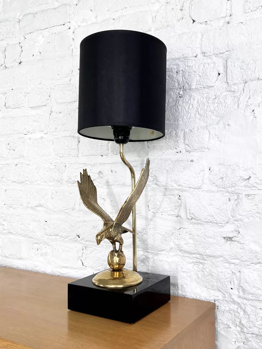 Brass lamp on black lacquered wooden base