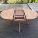 Renovated round extendable Scandinavian dining table in teak, 153cm.
