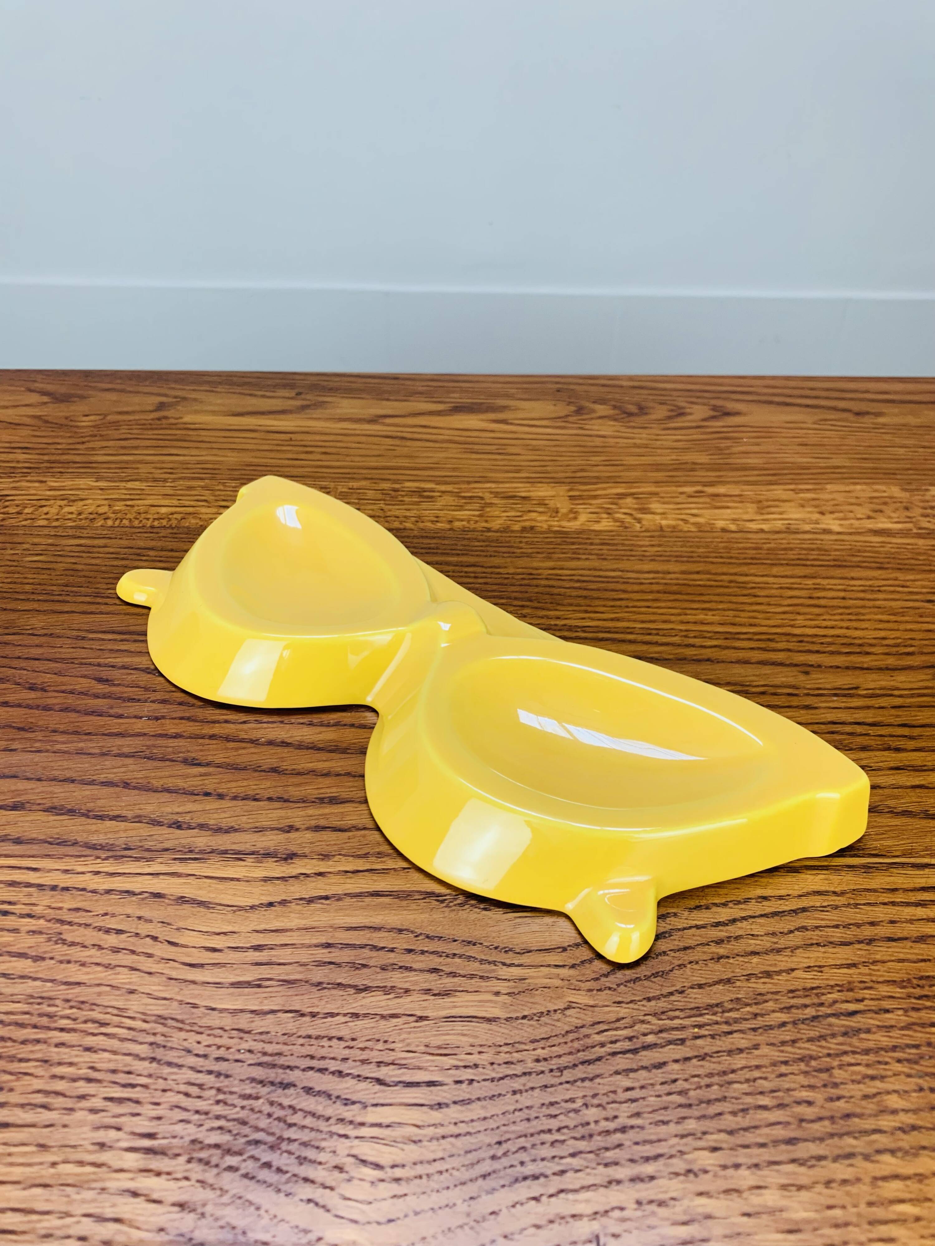 Vintage yellow ceramic glasses emptier