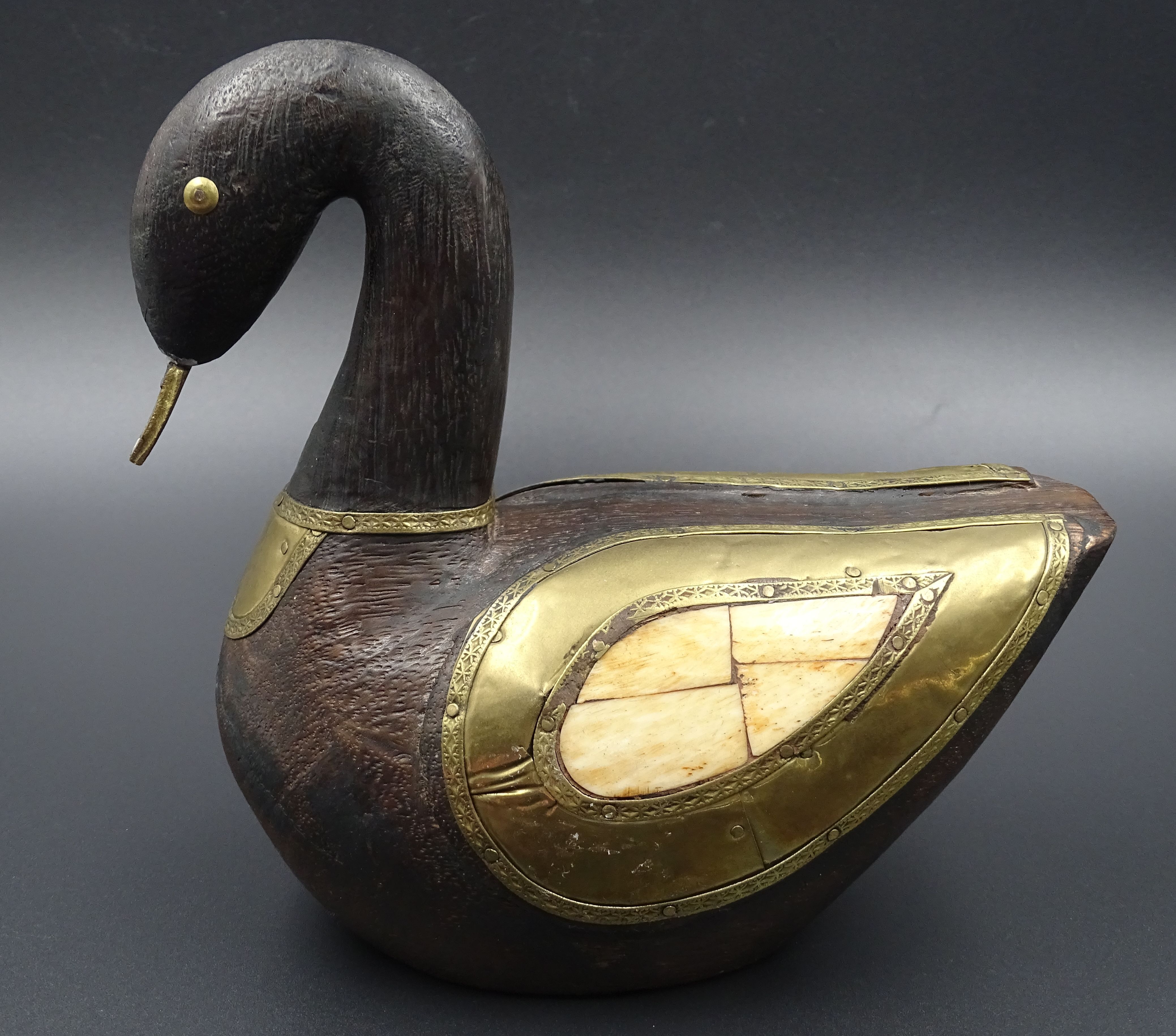 Wooden and brass swan